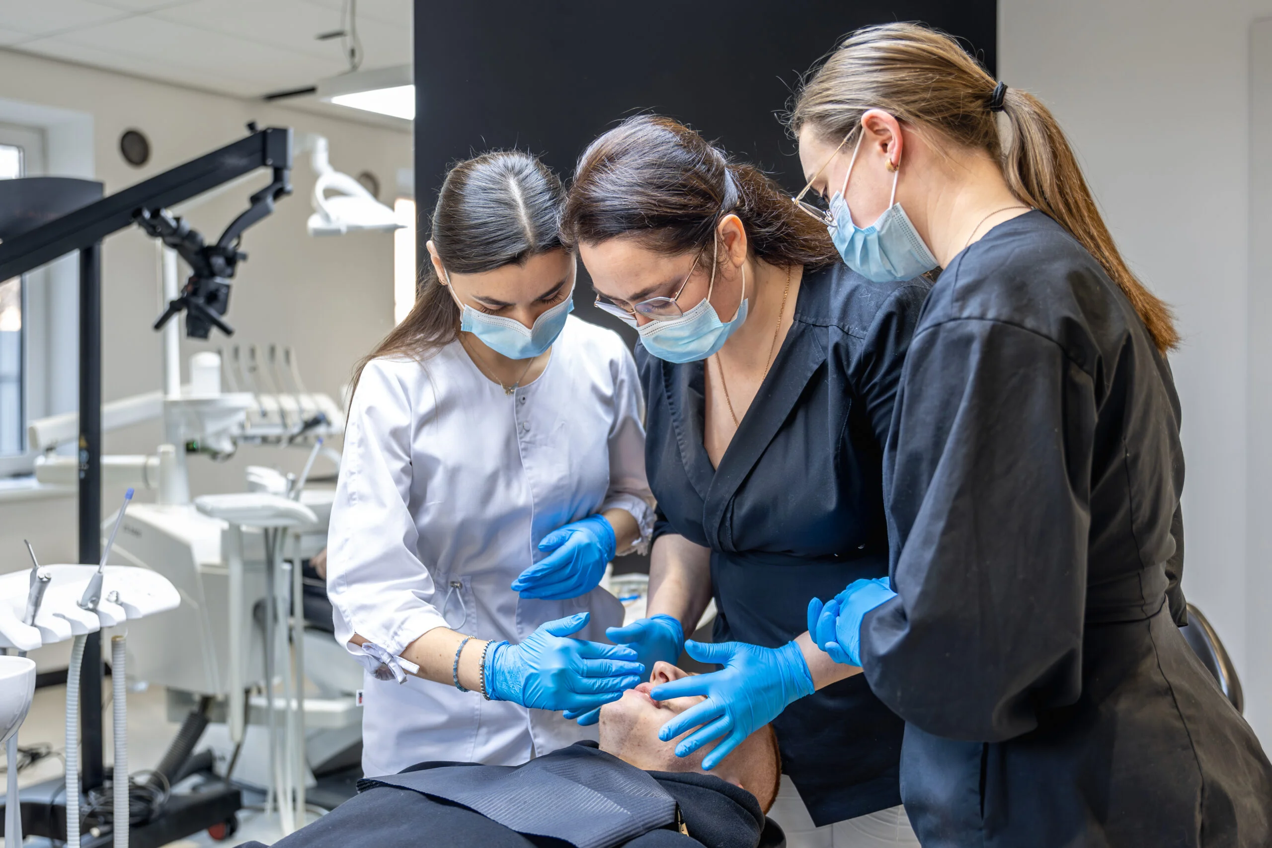 Dentists undergoing hands-on root canal treatment training during RCT workshop
